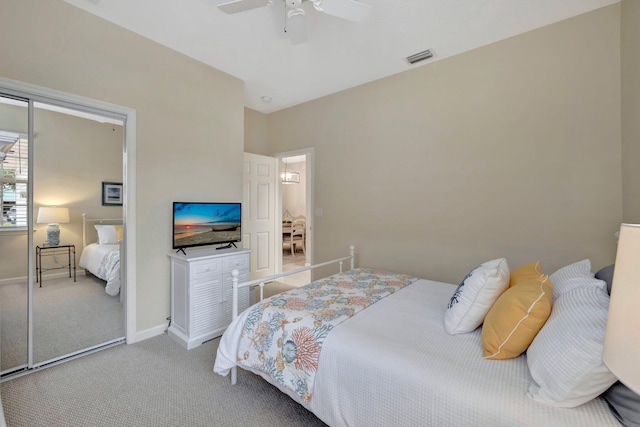 carpeted bedroom with ceiling fan