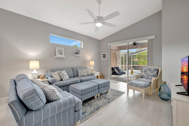 living room featuring vaulted ceiling, light hardwood / wood-style floors, and ceiling fan