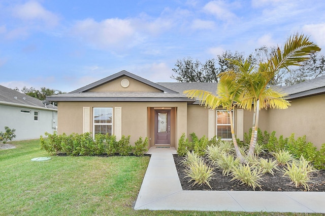 view of front of home featuring a front yard