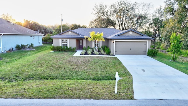 ranch-style home with a garage and a lawn