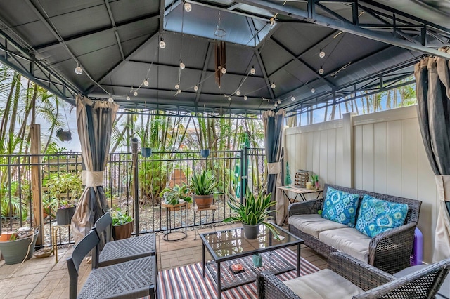 sunroom featuring vaulted ceiling