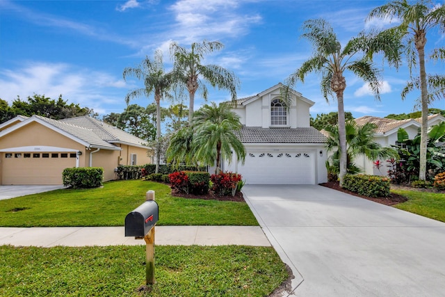 view of front facade with a front lawn and a garage