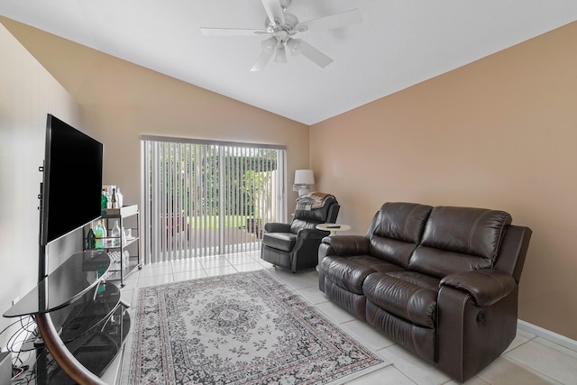 tiled living room with lofted ceiling and ceiling fan