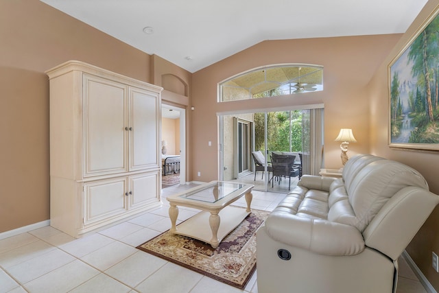 living room with high vaulted ceiling and light tile patterned floors