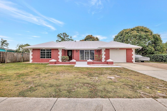 ranch-style home with a front yard and a garage