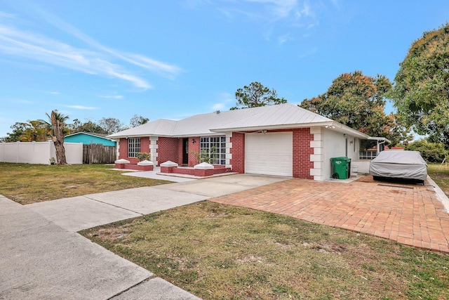 ranch-style house with a front yard and a garage