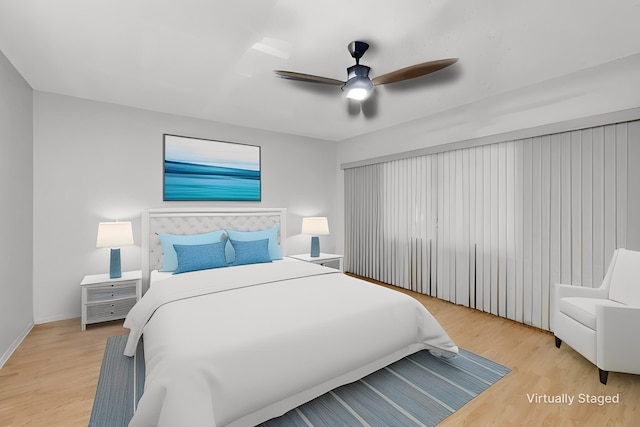 bedroom featuring ceiling fan and wood-type flooring