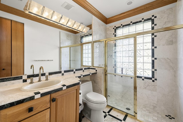 bathroom with vanity, toilet, and a shower with shower door