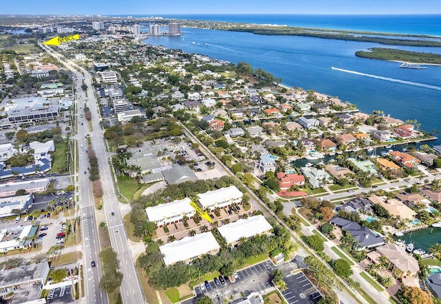 birds eye view of property with a water view