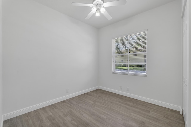 unfurnished room featuring ceiling fan and hardwood / wood-style floors