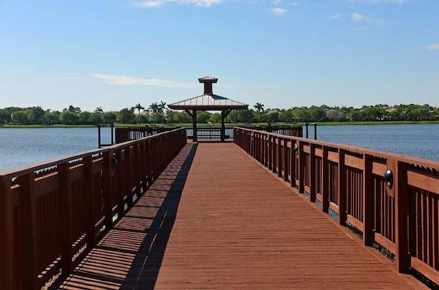 dock area with a gazebo and a water view