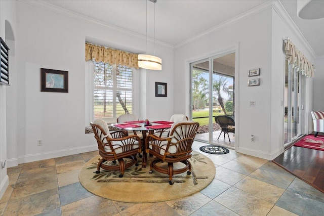 dining area featuring a wealth of natural light and ornamental molding