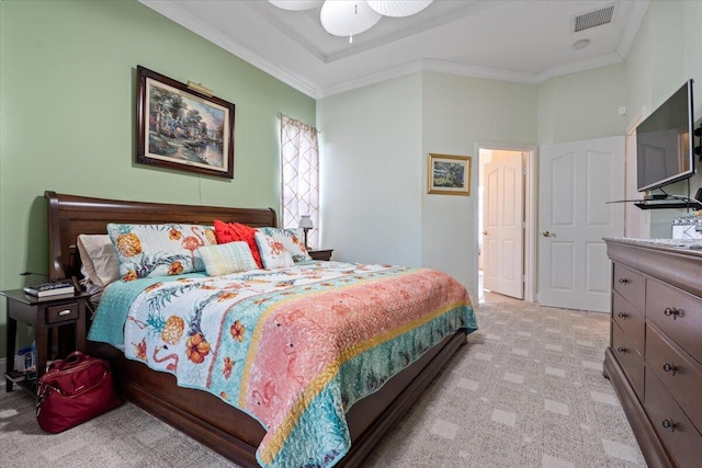 carpeted bedroom featuring ceiling fan and ornamental molding