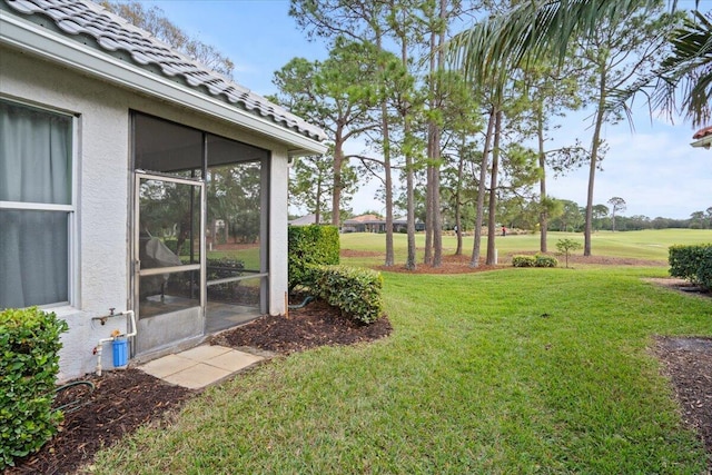 view of yard with a sunroom