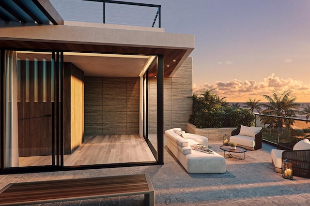 balcony at dusk with outdoor lounge area