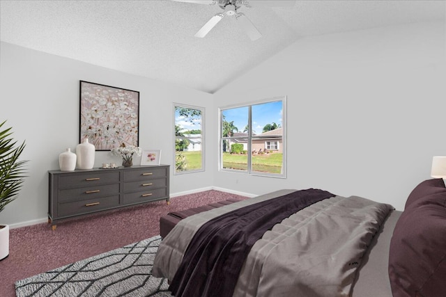 carpeted bedroom with ceiling fan, a textured ceiling, and lofted ceiling