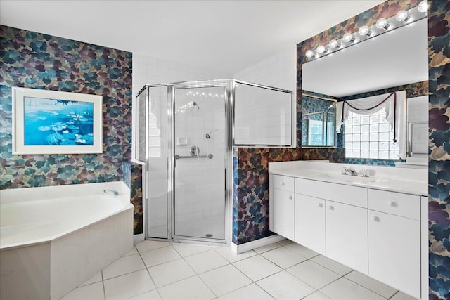 bathroom with vanity, independent shower and bath, and tile patterned flooring