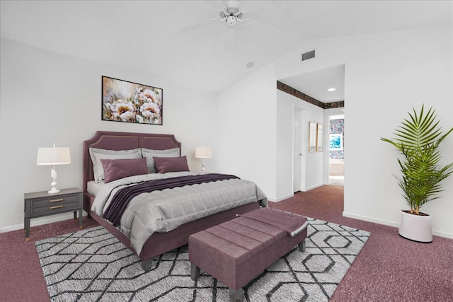 carpeted bedroom with ceiling fan, ensuite bathroom, and vaulted ceiling