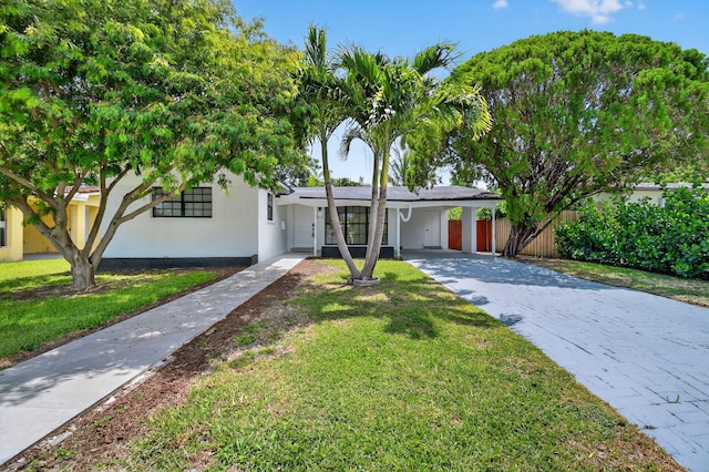 2112 N 14th Ter, Hollywood, FL 33020 - view of front of property with a carport and driveway