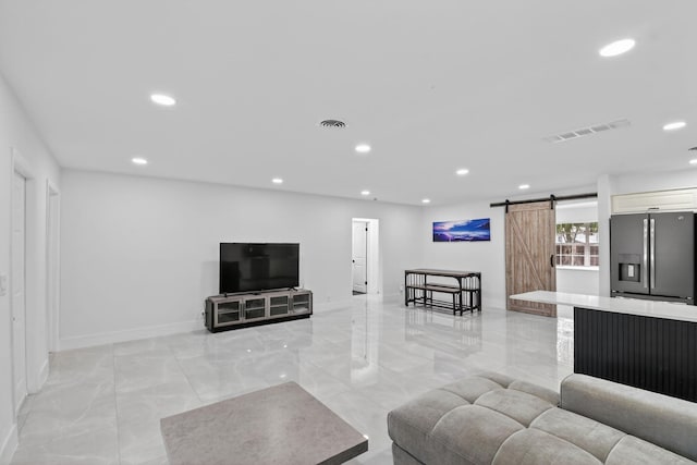 2112 N 14th Ter, Hollywood, FL 33020 - living area featuring a barn door, light marble finish floors, and recessed lighting