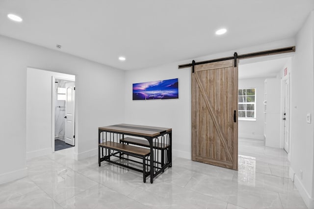 2112 N 14th Ter, Hollywood, FL 33020 - dining room featuring a barn door, recessed lighting, and light marble finish flooring