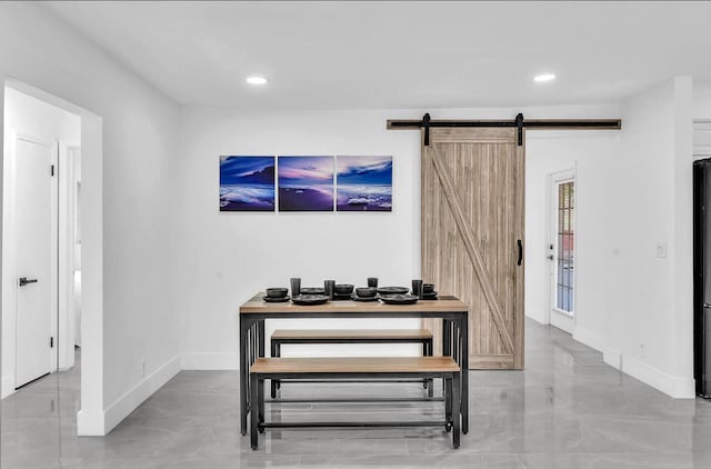 dining area with a barn door