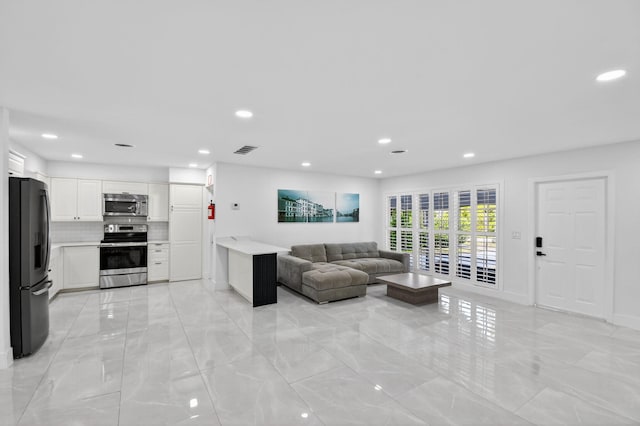 2112 N 14th Ter, Hollywood, FL 33020 - living area with light marble finish flooring and recessed lighting