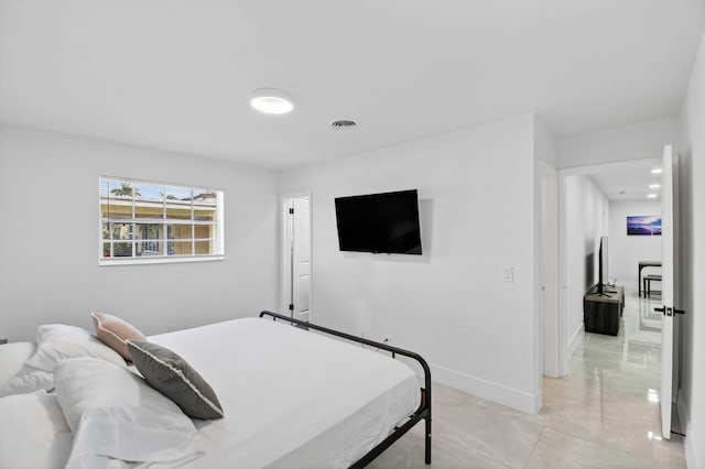2112 N 14th Ter, Hollywood, FL 33020 - bedroom with light marble finish flooring and baseboards