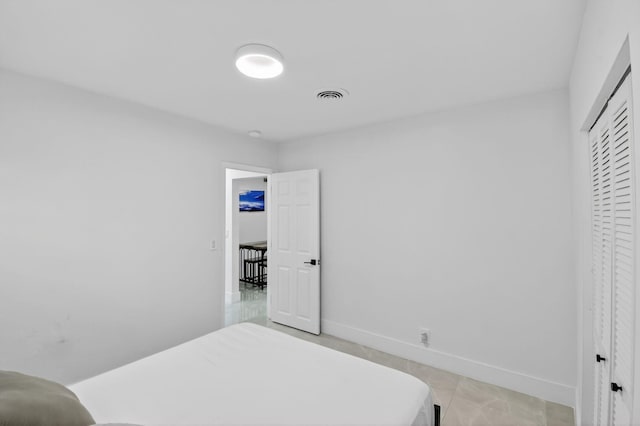 2112 N 14th Ter, Hollywood, FL 33020 - bedroom featuring a closet and light tile patterned floors