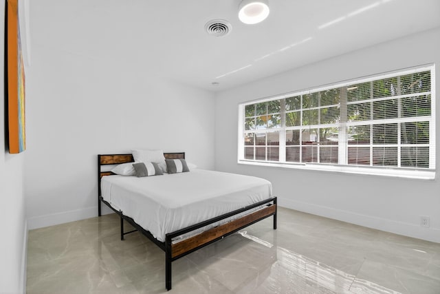 2112 N 14th Ter, Hollywood, FL 33020 - bedroom featuring baseboards and light marble finish floors