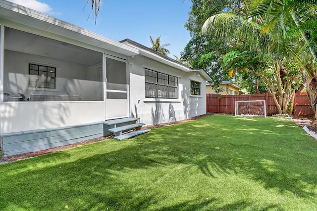 2112 N 14th Ter, Hollywood, FL 33020 - view of yard with entry steps and a sunroom