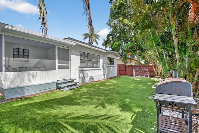 2112 N 14th Ter, Hollywood, FL 33020 - view of yard featuring entry steps and a sunroom