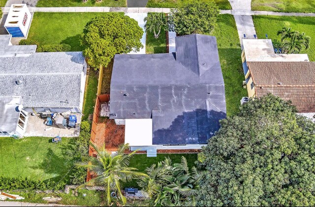 view of front of property featuring a front lawn and a sunroom