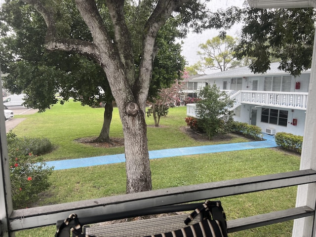 view of yard featuring a balcony