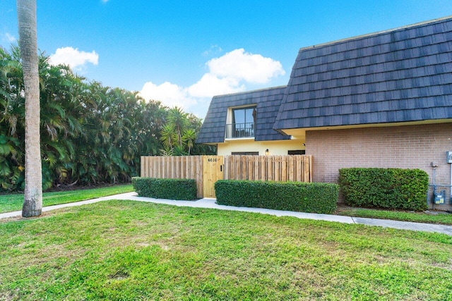 view of property exterior featuring a lawn