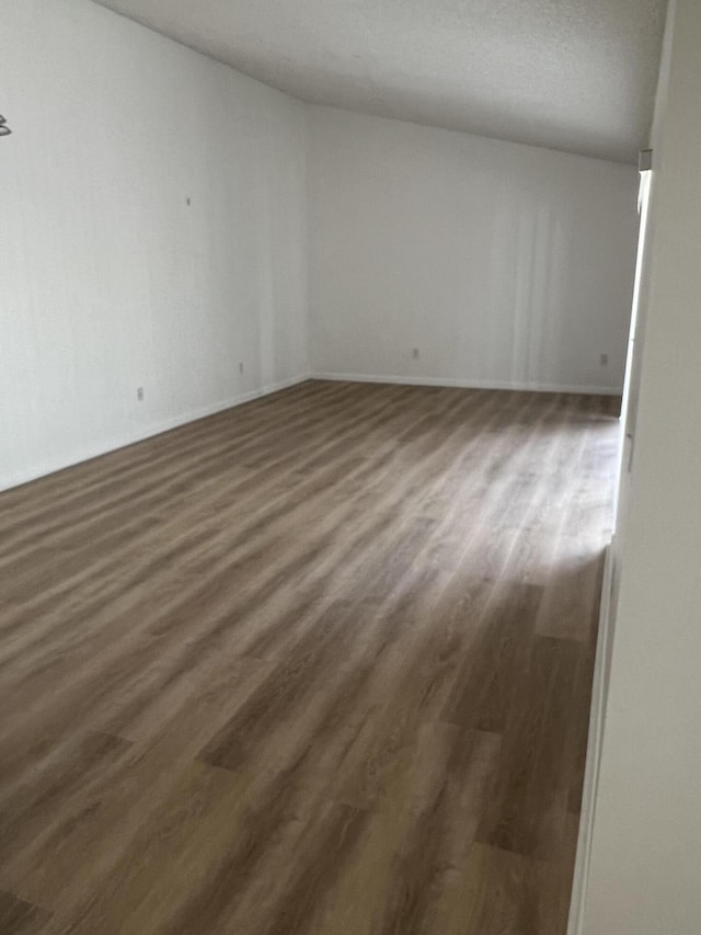 spare room featuring dark hardwood / wood-style flooring