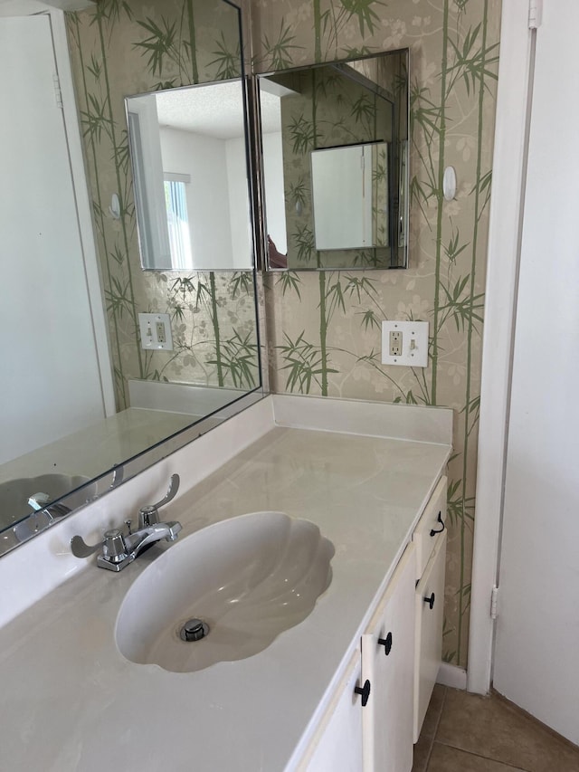 bathroom with vanity and tile patterned floors