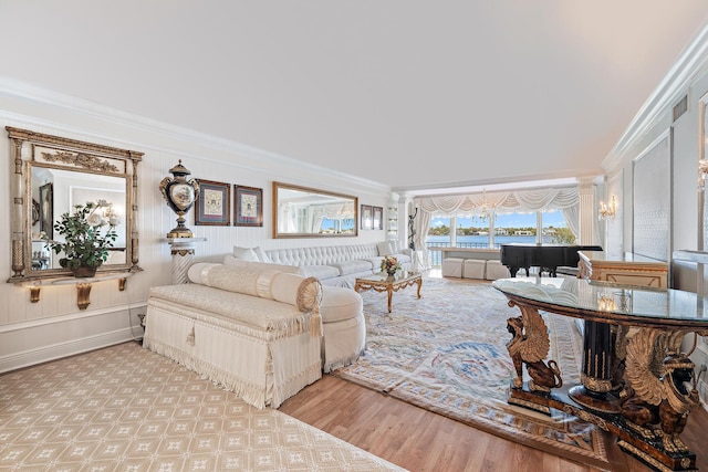 living room featuring crown molding and light hardwood / wood-style floors