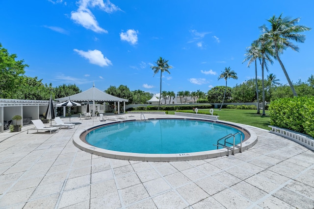 view of swimming pool featuring a patio area