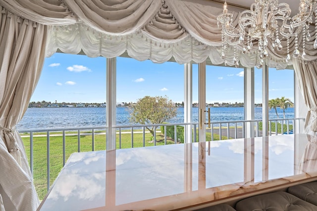 unfurnished sunroom with a water view