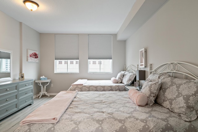 bedroom featuring light wood-type flooring