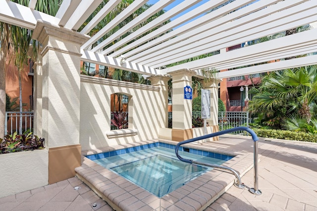 view of pool featuring a pergola, a patio area, and a hot tub