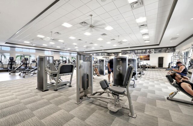 gym featuring light colored carpet and a paneled ceiling