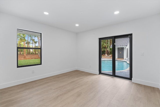 unfurnished room featuring light hardwood / wood-style floors