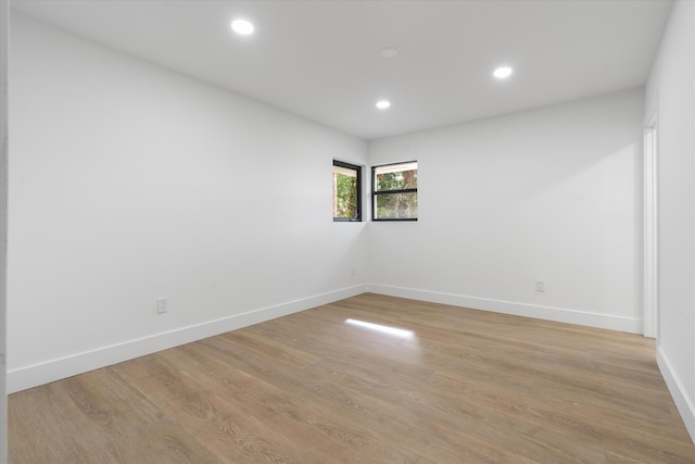 spare room with light hardwood / wood-style floors