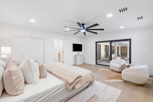 bedroom with ceiling fan, access to exterior, a closet, and light hardwood / wood-style flooring