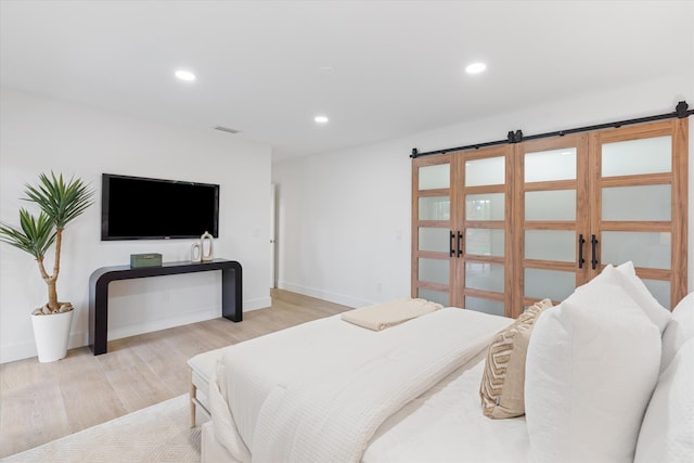 bedroom with light wood-type flooring