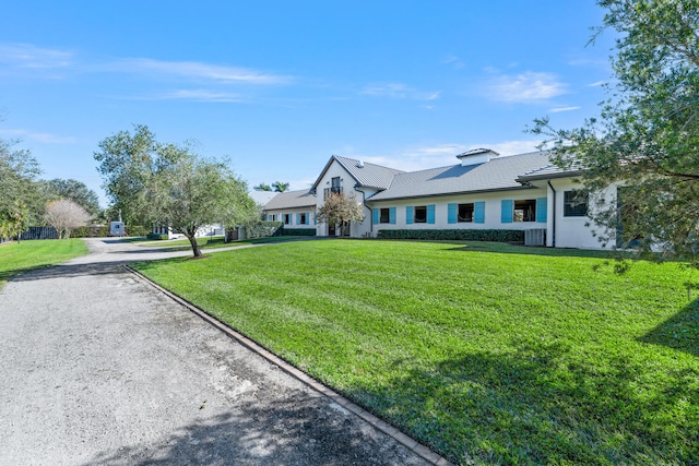 single story home featuring a front yard