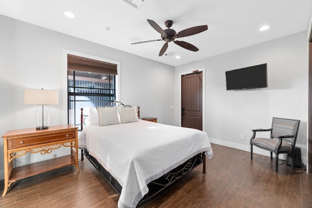 bedroom featuring ceiling fan and dark hardwood / wood-style flooring