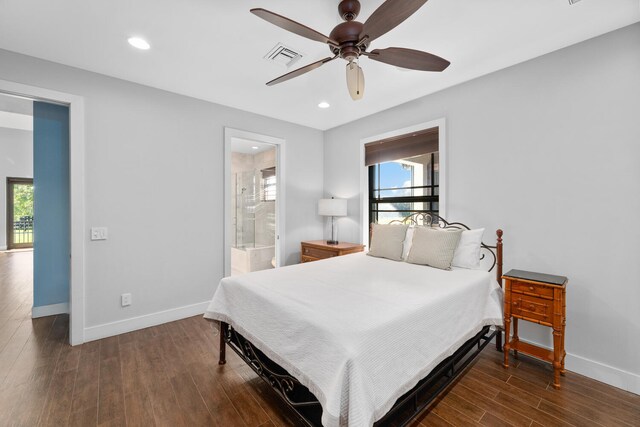 bedroom with dark wood-type flooring, ceiling fan, and ensuite bathroom